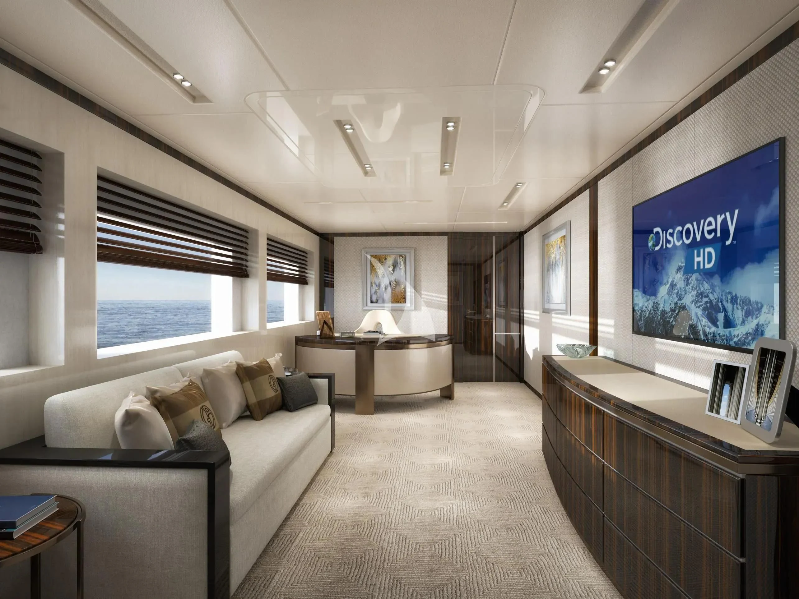 a living room with a large screen aboard LADY A Yacht for Sale