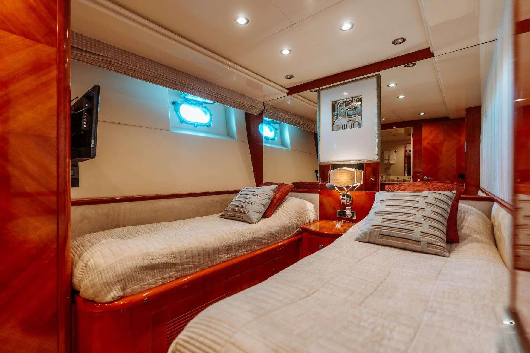 a room with a bed and a television aboard ENDLESS SUN Yacht for Sale