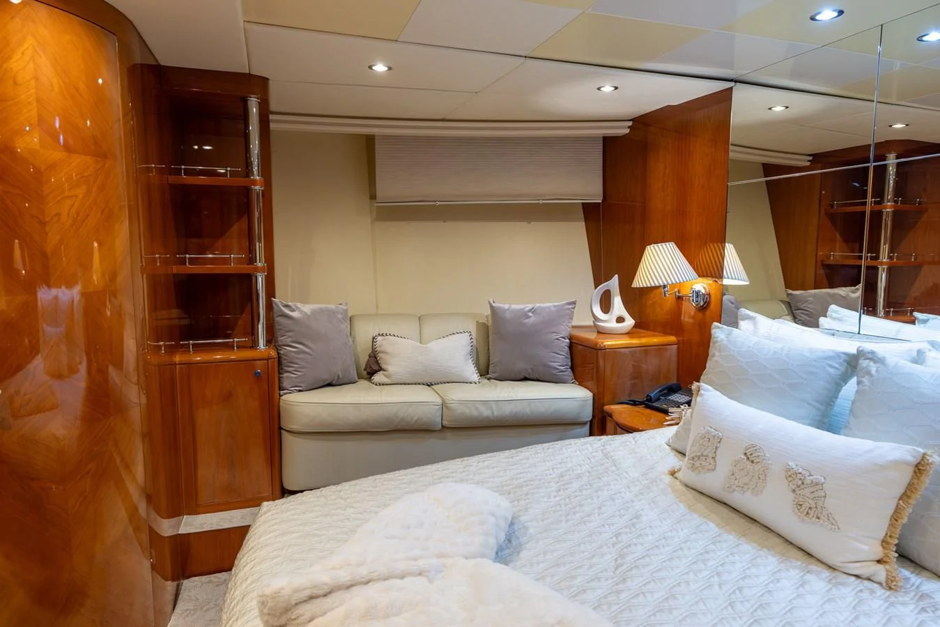 a room with a bed and a couch aboard ENDLESS SUN Yacht for Sale
