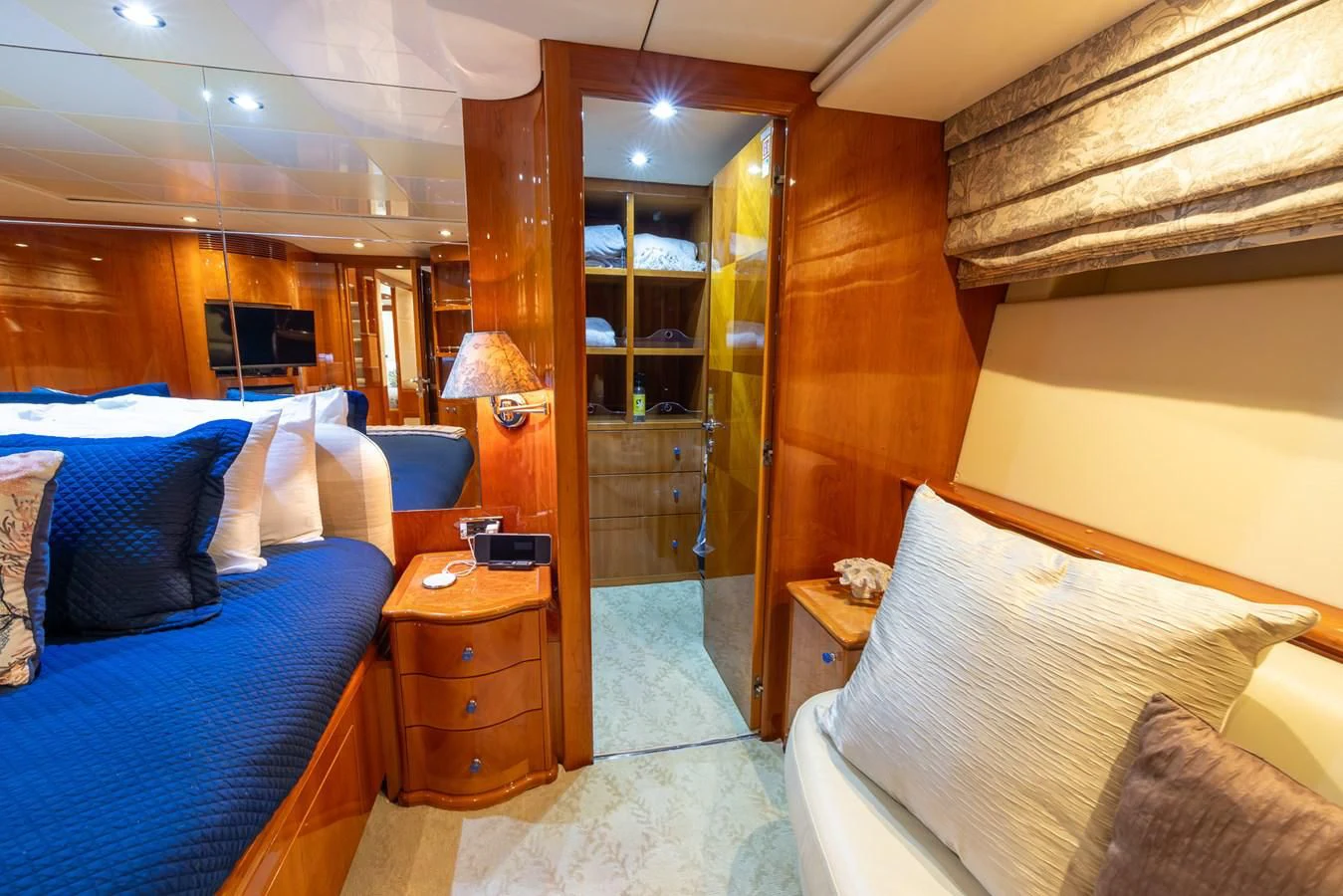 a room with a bed and a desk aboard ENDLESS SUN Yacht for Sale