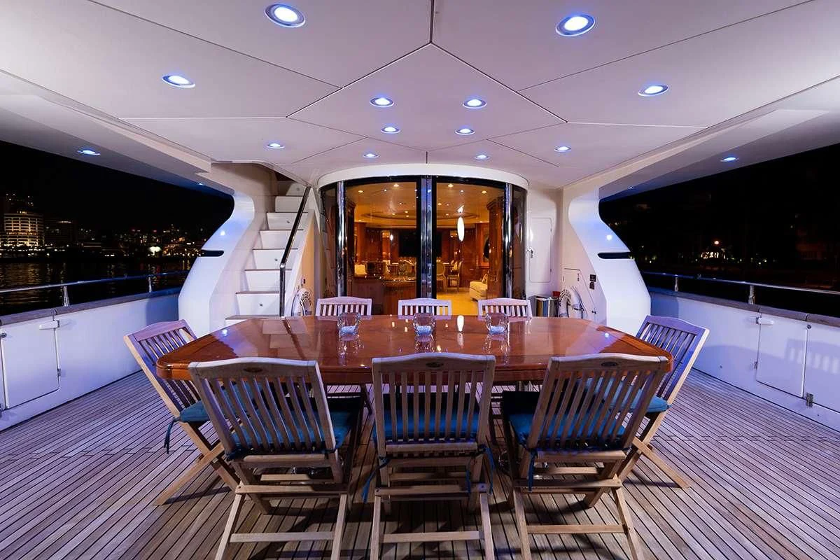 a room with tables and chairs aboard ENDLESS SUN Yacht for Sale
