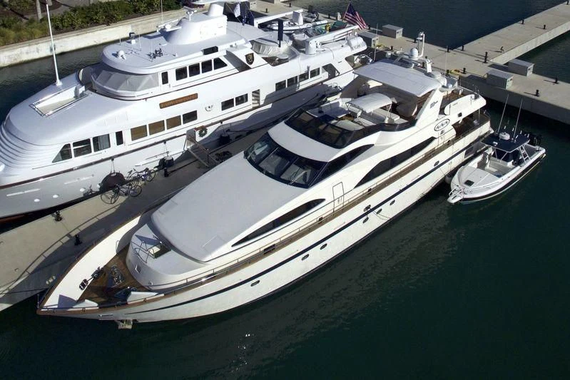 a large white boat docked at a pier aboard ENDLESS SUN Yacht for Sale