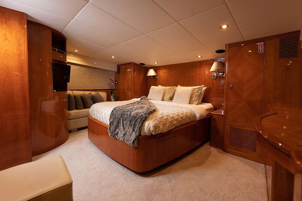 a large bed in a room aboard ENDLESS SUN Yacht for Sale