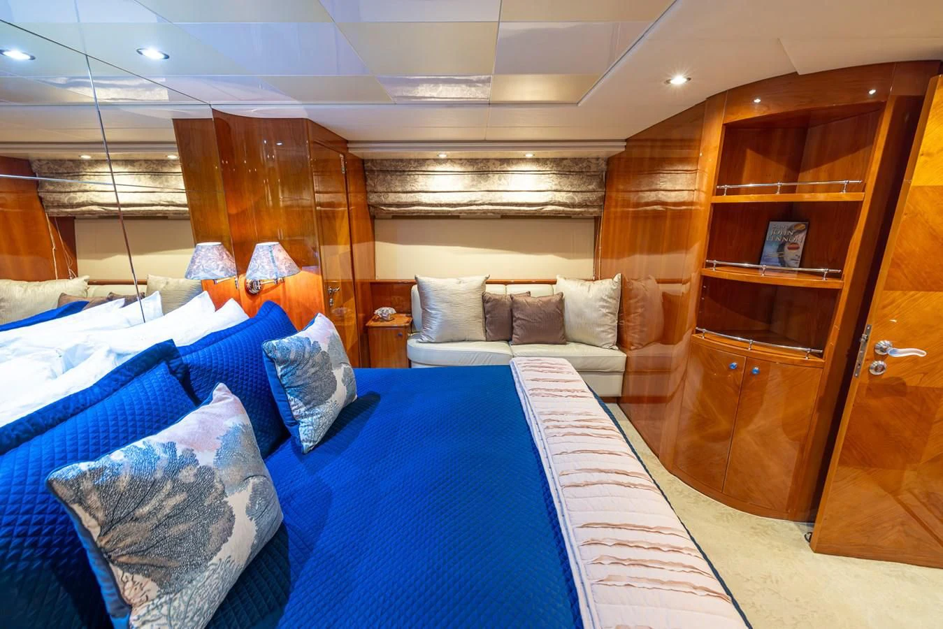 a room with a bed and a chair aboard ENDLESS SUN Yacht for Sale