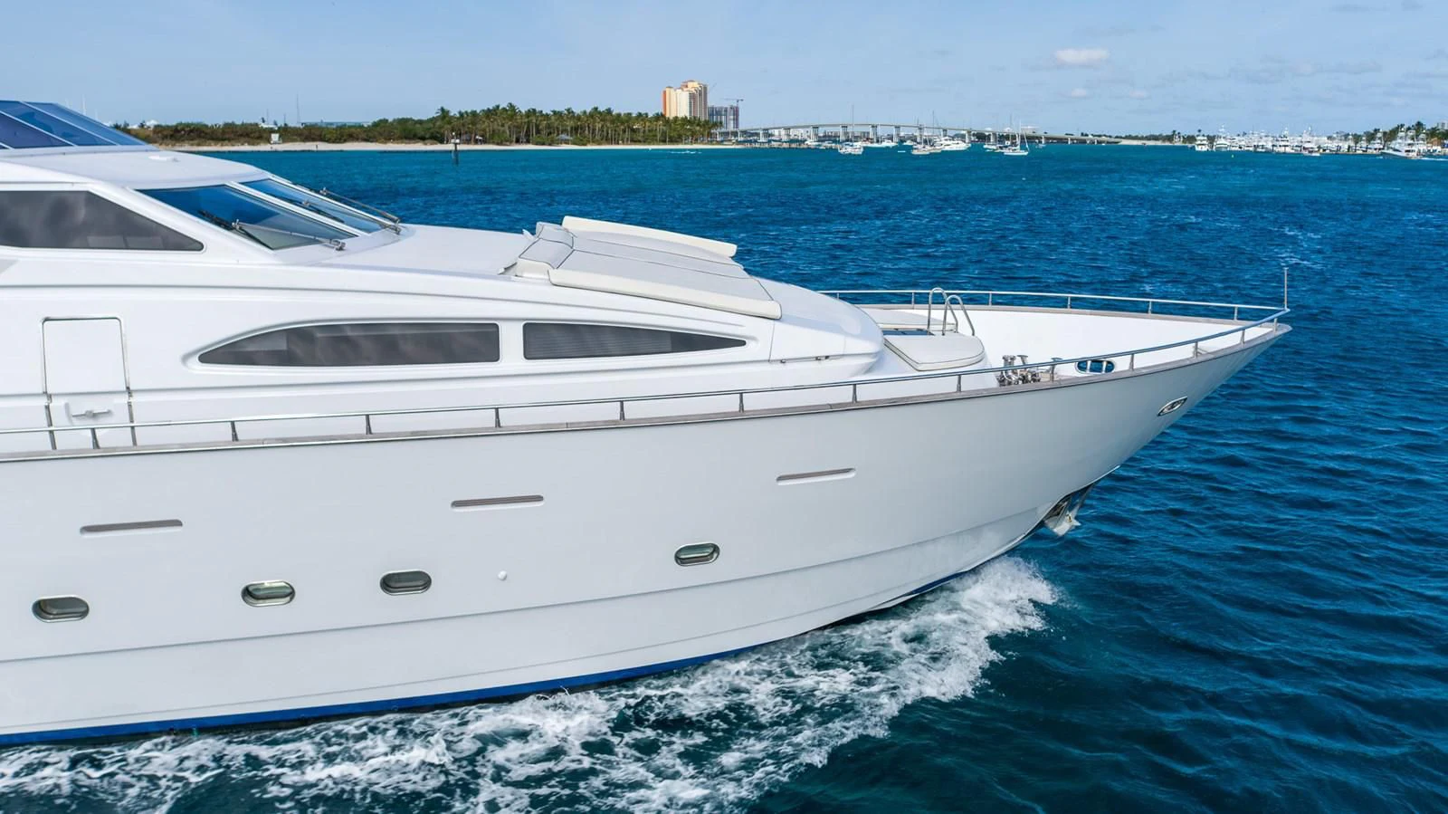 a white yacht on the water aboard ENDLESS SUN Yacht for Sale