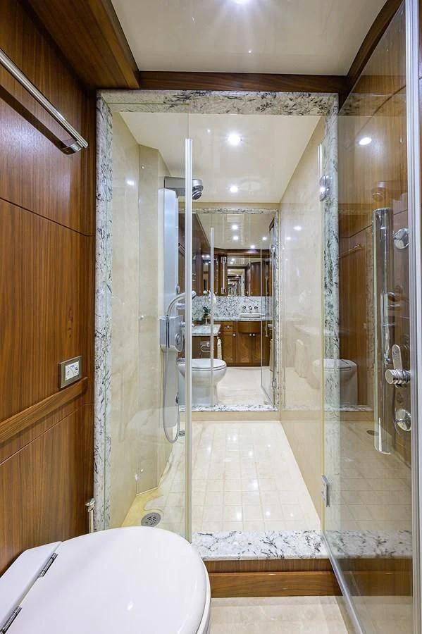 a bathroom with a glass shower aboard ONE SHOT Yacht for Sale