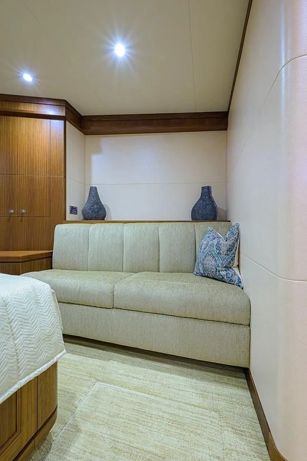 a couch in a room aboard ONE SHOT Yacht for Sale