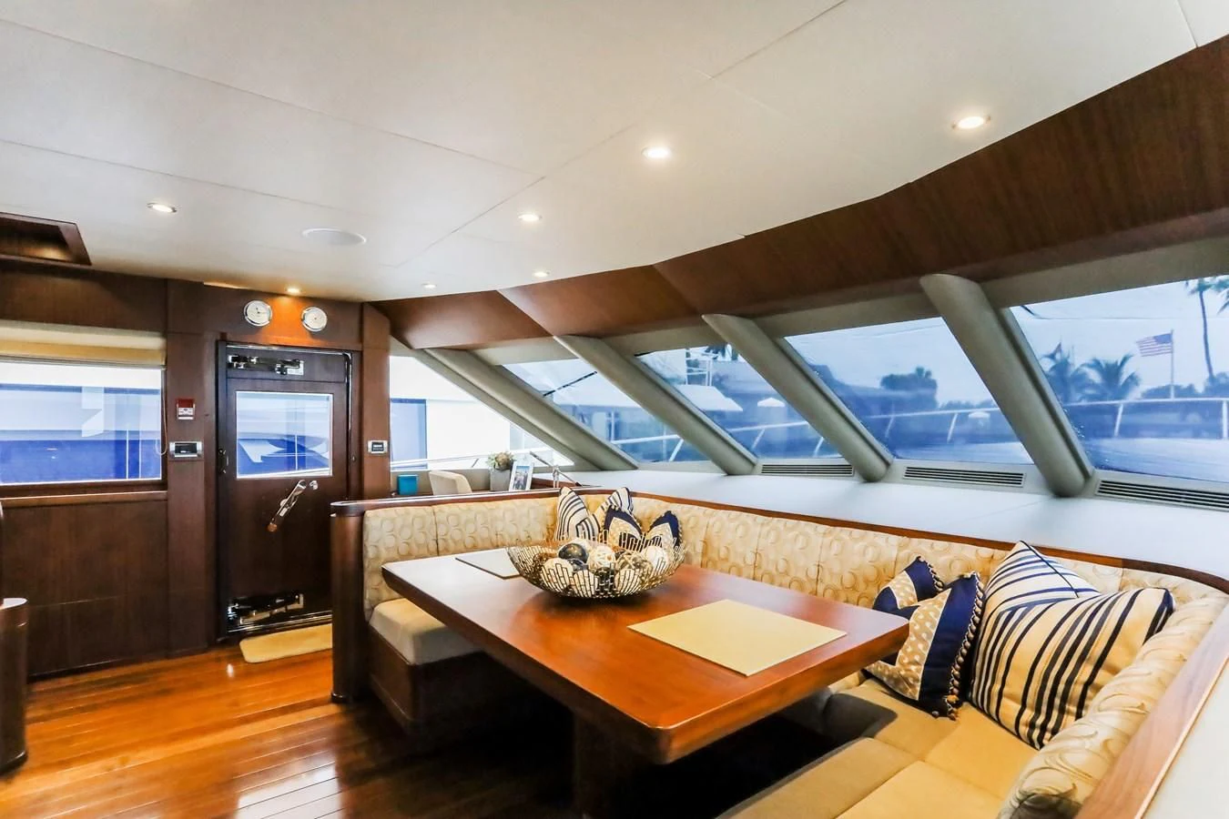 a room with a table and chairs aboard ONE SHOT Yacht for Sale