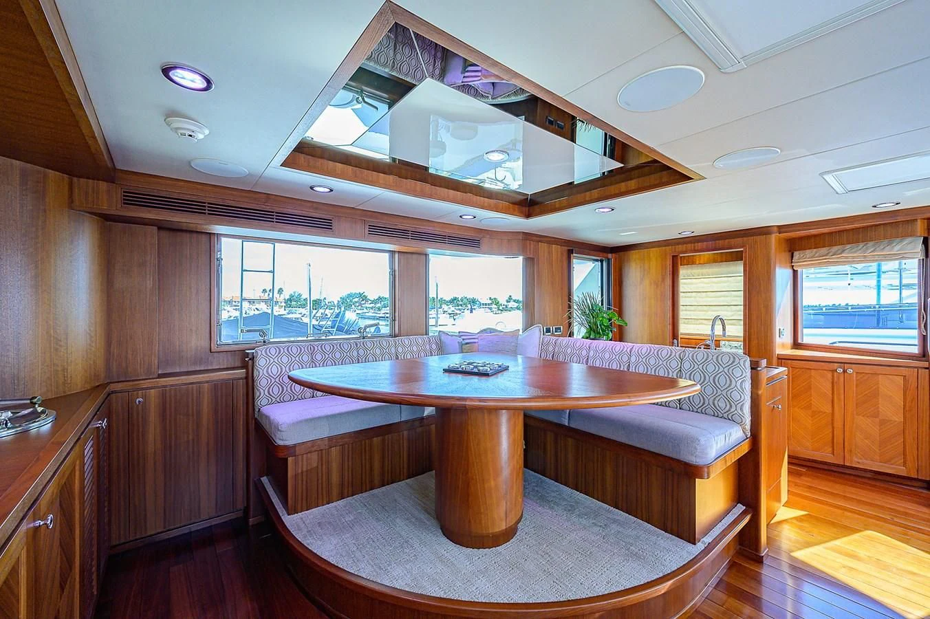 a large kitchen with a table and chairs aboard ONE SHOT Yacht for Sale
