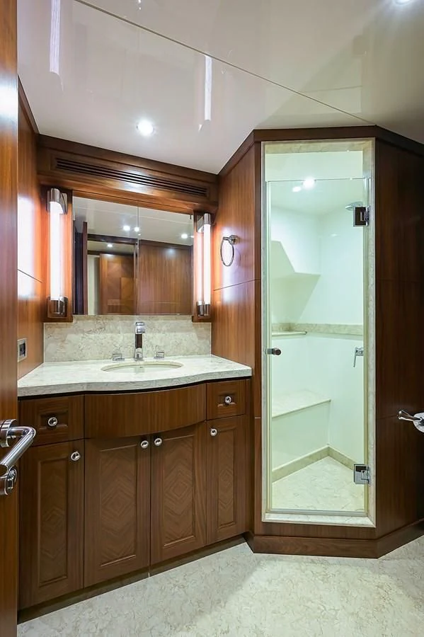 a bathroom with a large mirror aboard ONE SHOT Yacht for Sale