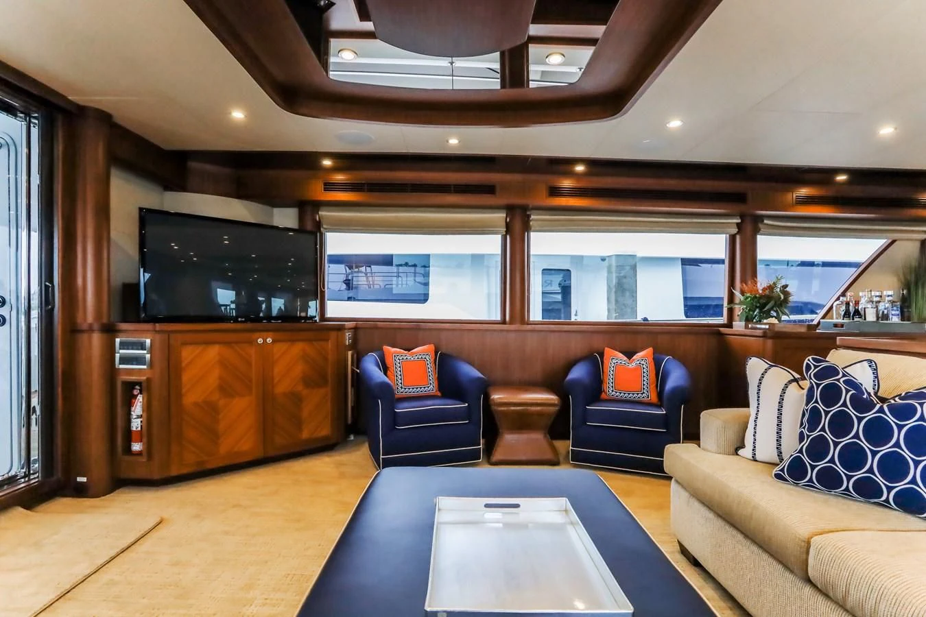 a living room with a large tv aboard ONE SHOT Yacht for Sale
