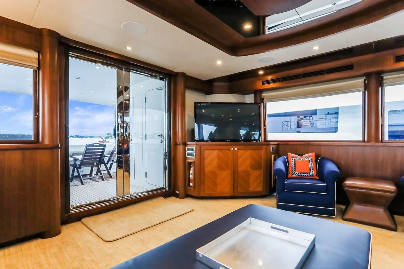 a living room with a large glass door aboard ONE SHOT Yacht for Sale