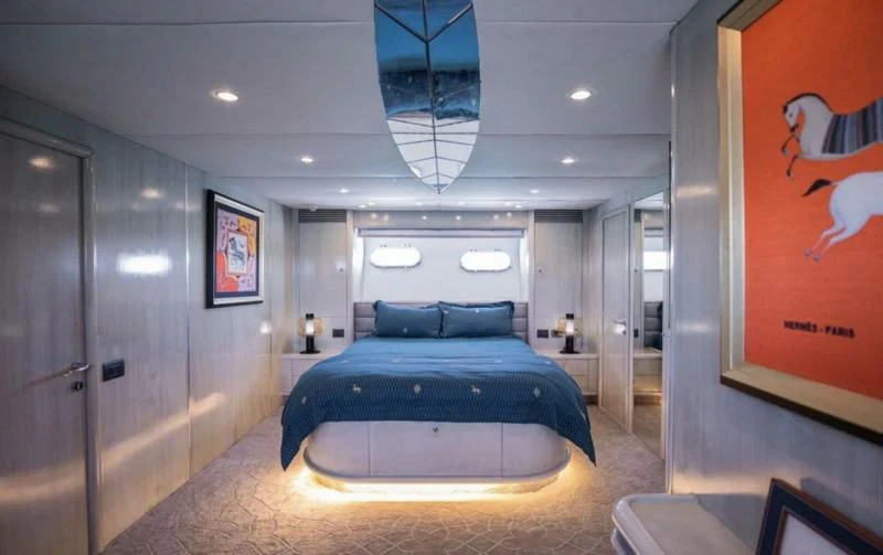 a large bedroom with a large bed aboard UD30 Yacht for Sale