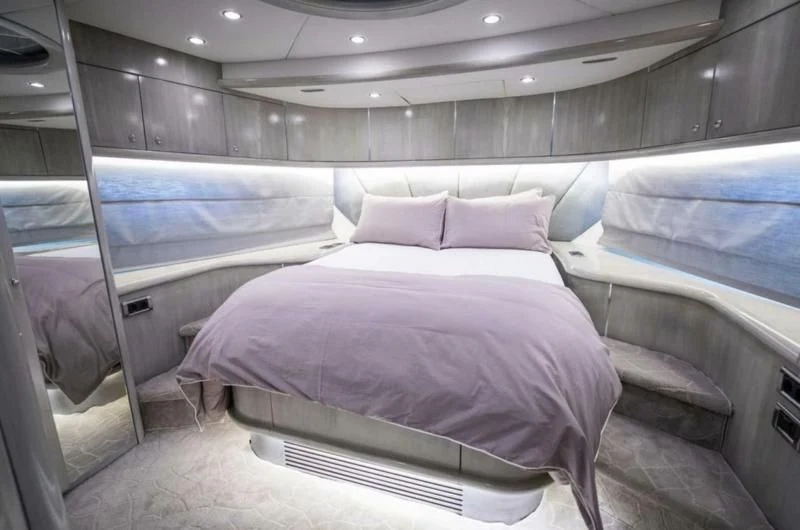 a room with a bed and a window aboard UD30 Yacht for Sale