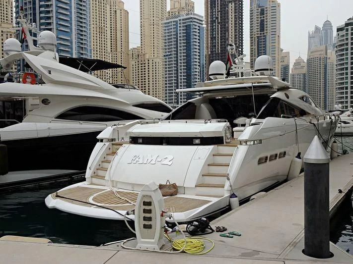a white boat with a black and white body aboard UD30 Yacht for Sale