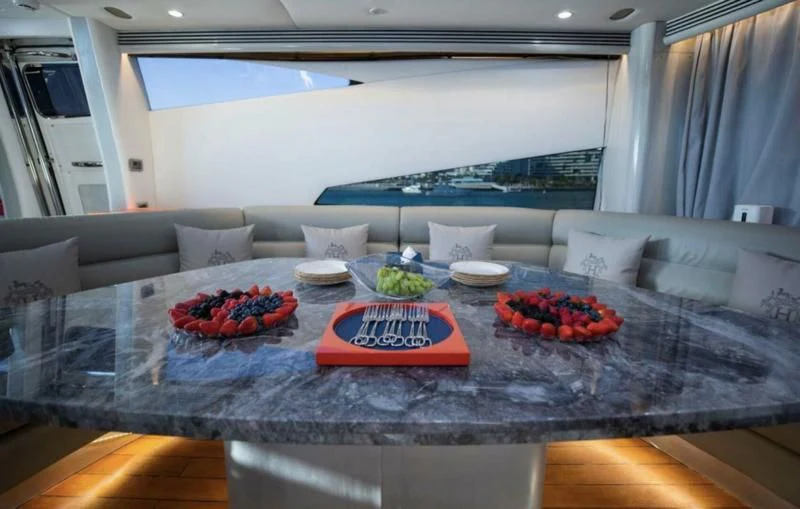 a table with food on it aboard UD30 Yacht for Sale