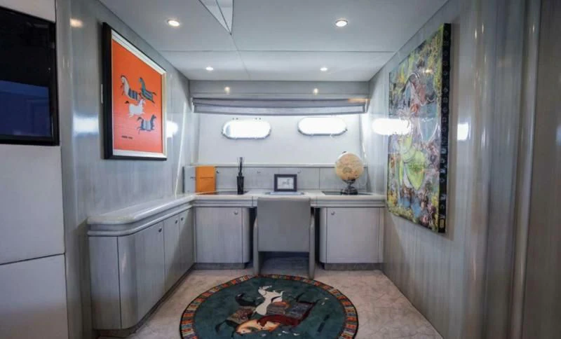a large kitchen with a rug aboard UD30 Yacht for Sale