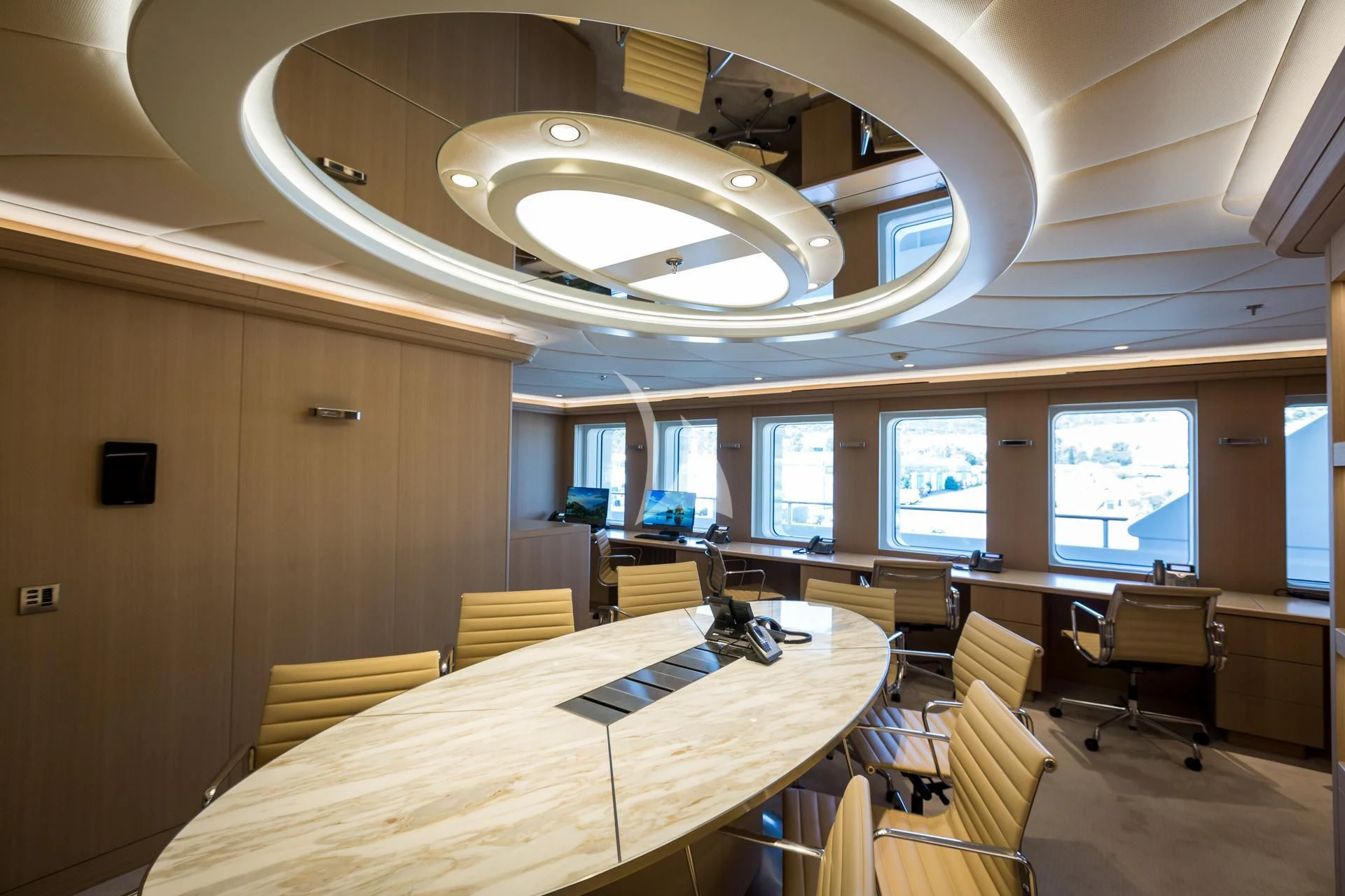 a room with tables and chairs aboard DREAM Yacht for Sale