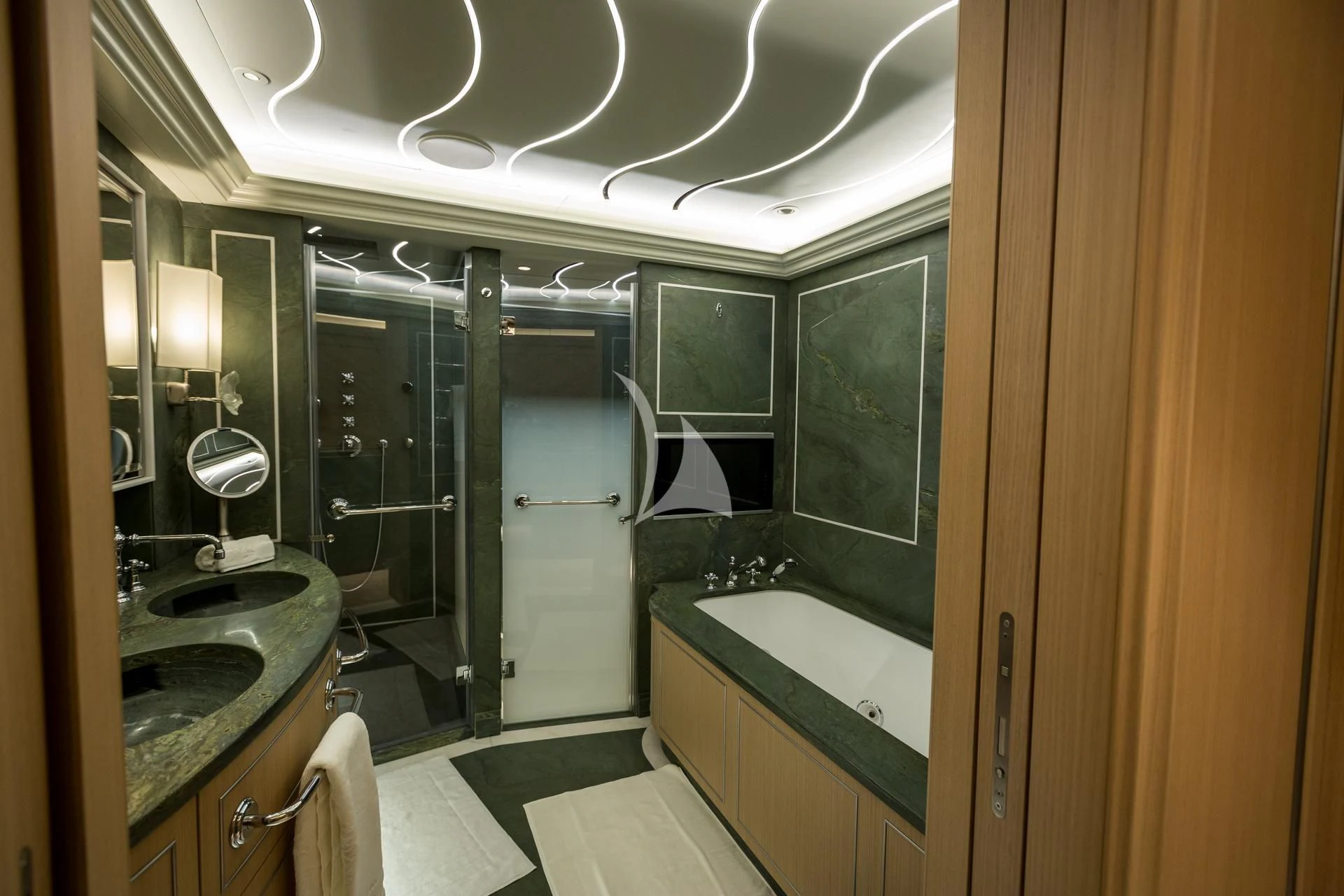 a bathroom with a large mirror aboard DREAM Yacht for Sale