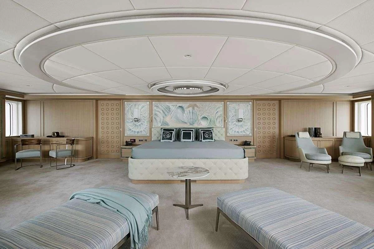 a large room with a pool table and chairs aboard DREAM Yacht for Sale