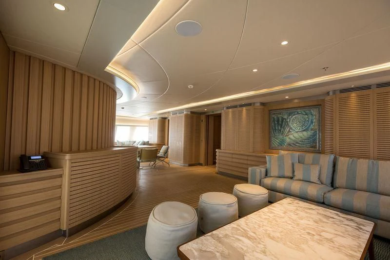 a living room with a couch and a table aboard DREAM Yacht for Sale