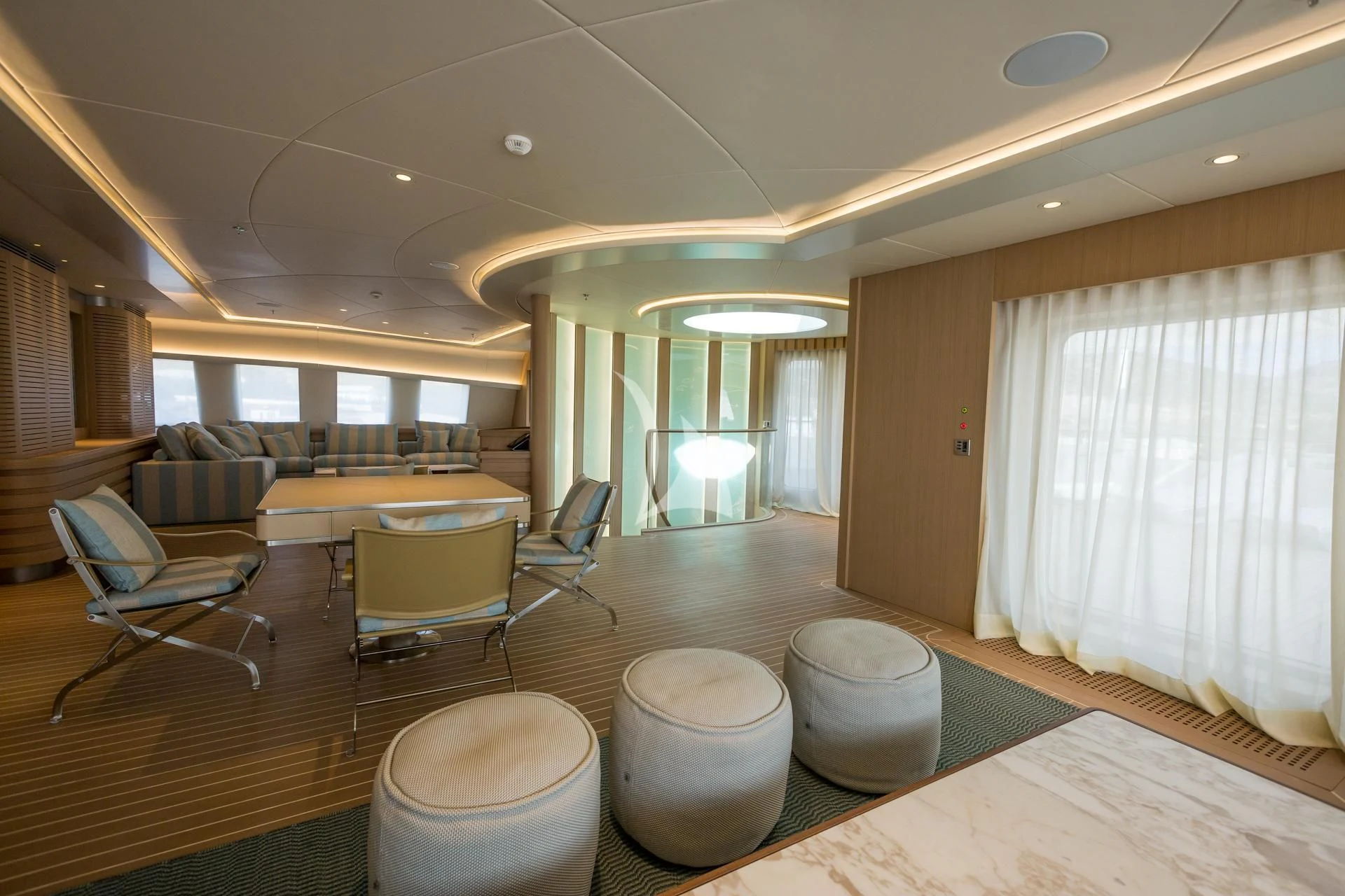 a large living room with a large window aboard DREAM Yacht for Sale