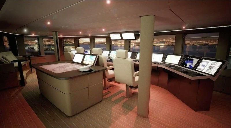 a room with a couch and a table with computers on it aboard DREAM Yacht for Sale