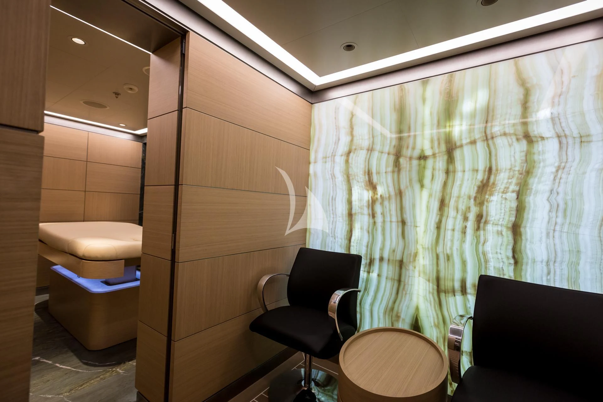 a bathroom with a toilet and a chair aboard DREAM Yacht for Sale