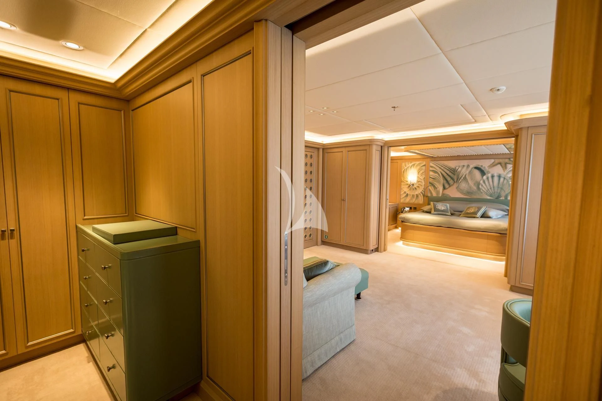 a room with a bed and a closet aboard DREAM Yacht for Sale