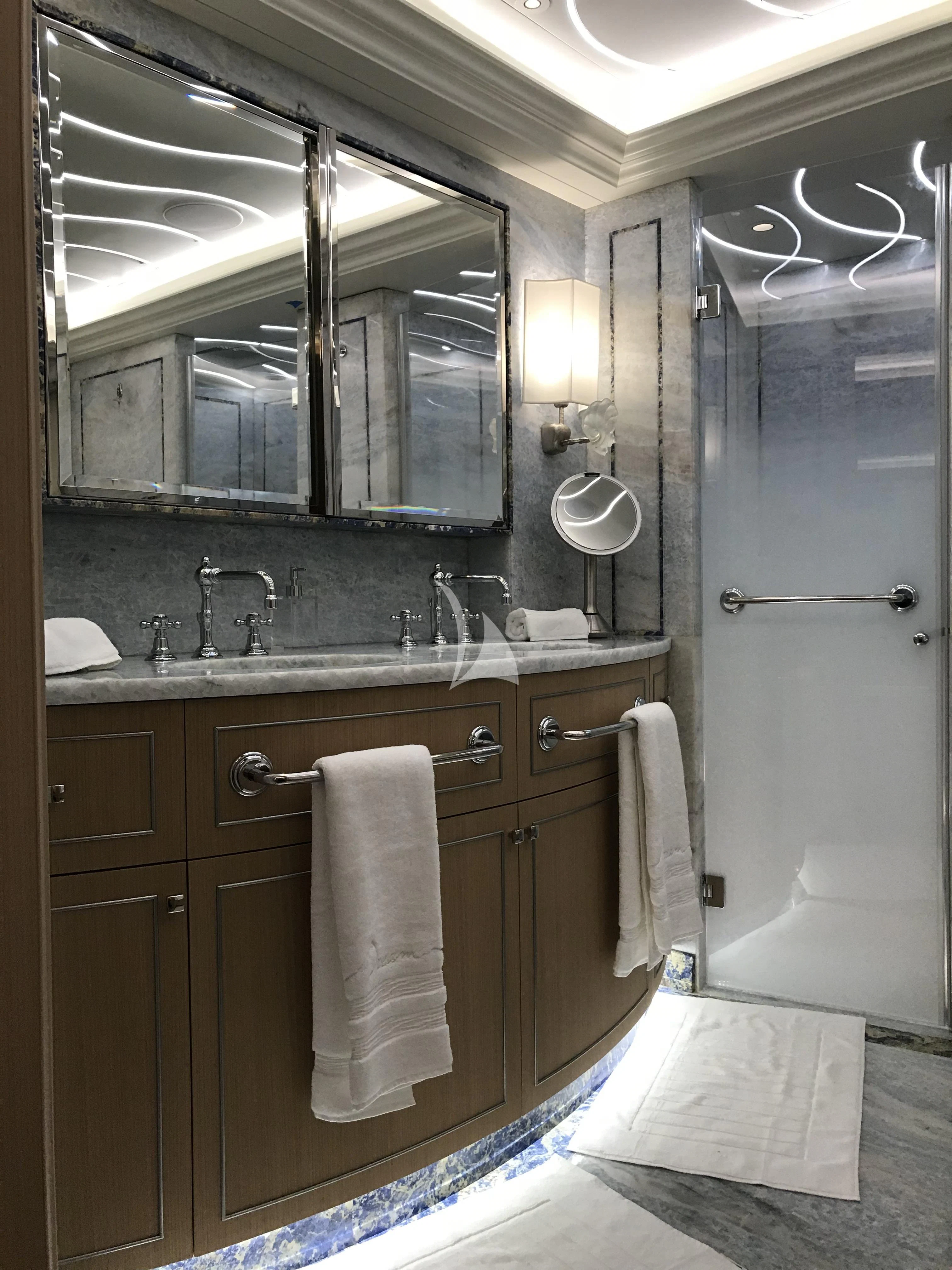 a bathroom with a large mirror aboard DREAM Yacht for Sale