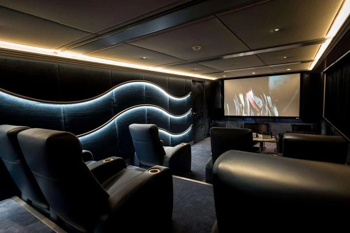 inside of a vehicle with seats and a screen on the side aboard DREAM Yacht for Sale
