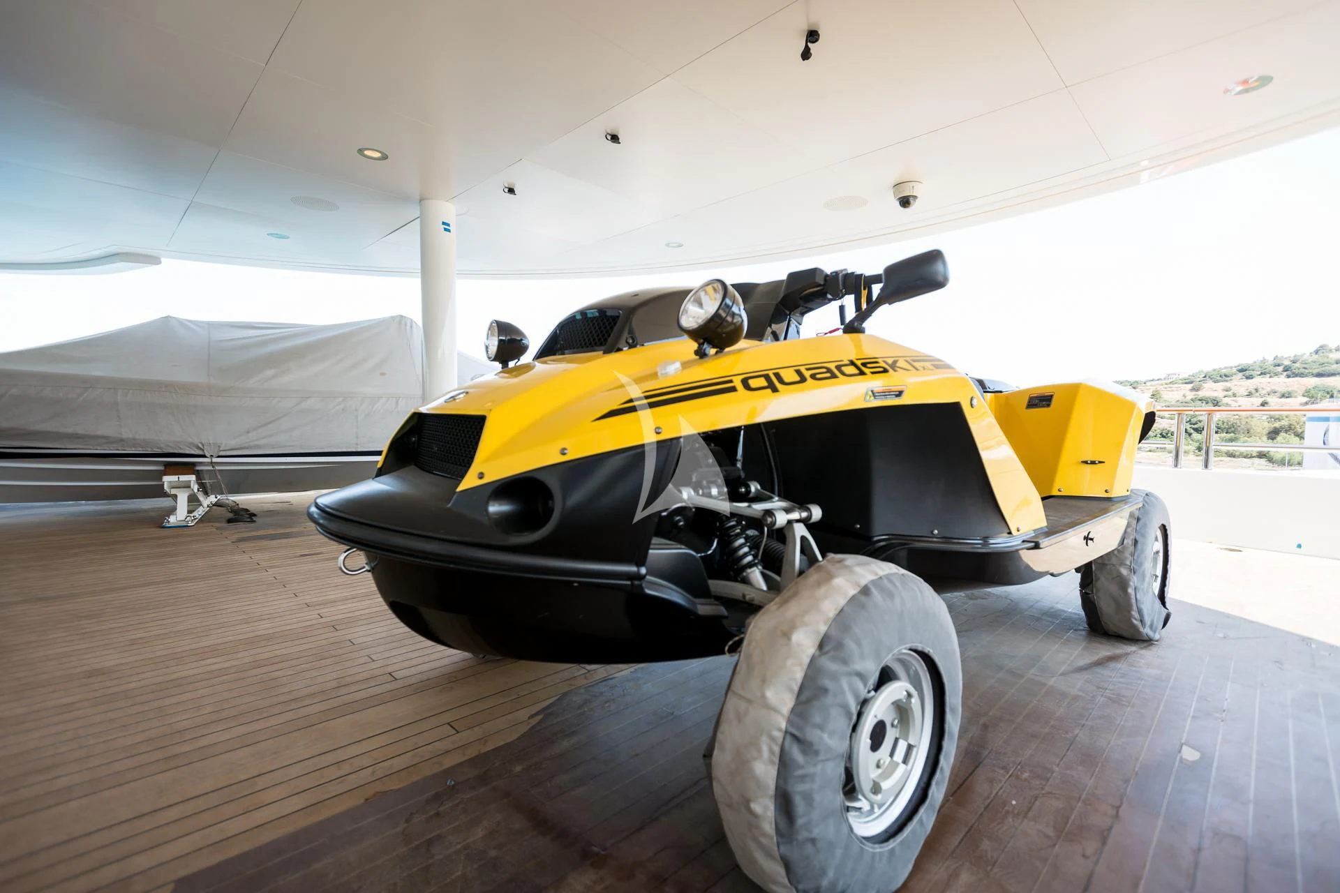 a yellow and black race car aboard DREAM Yacht for Sale