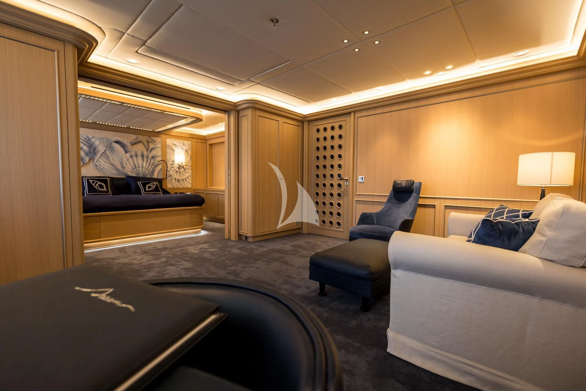 a room with a bed and a chair aboard DREAM Yacht for Sale