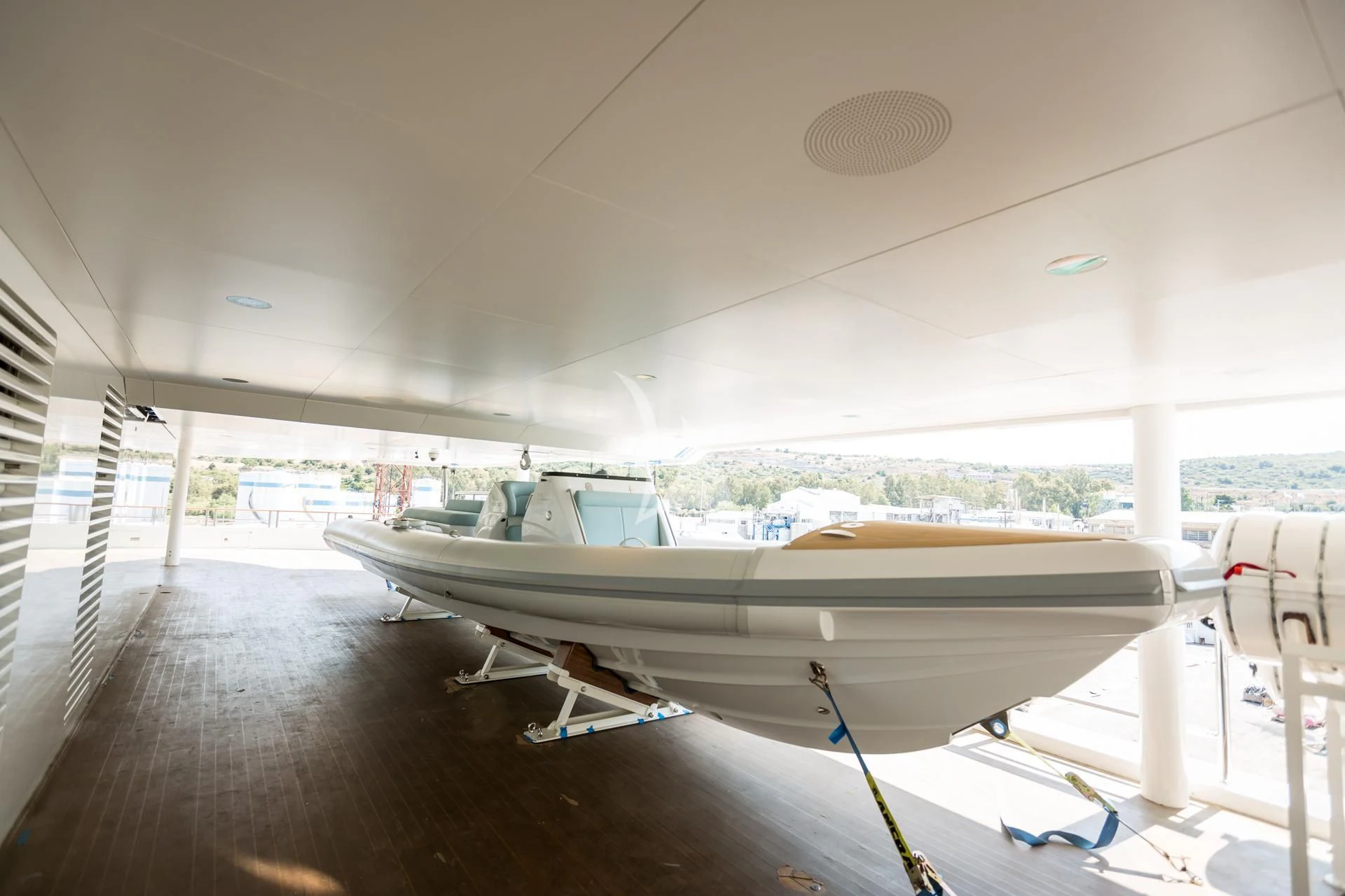 a large white airplane on a runway aboard DREAM Yacht for Sale