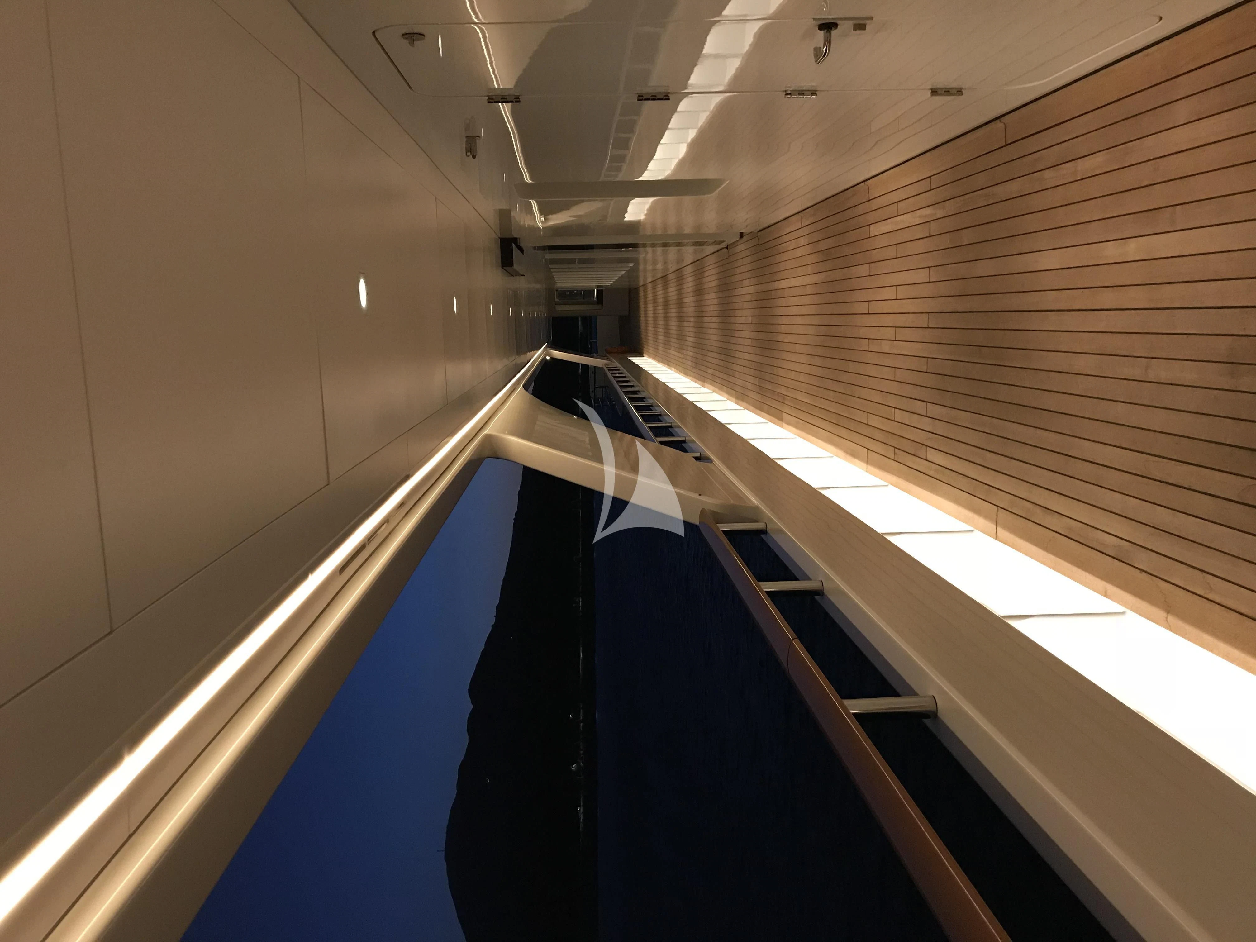 a hallway with a couple of escalators aboard DREAM Yacht for Sale