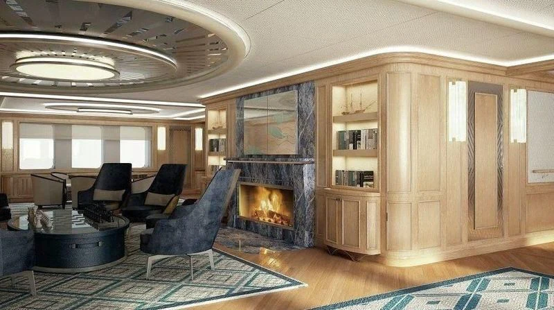 a living room with a fireplace aboard DREAM Yacht for Sale
