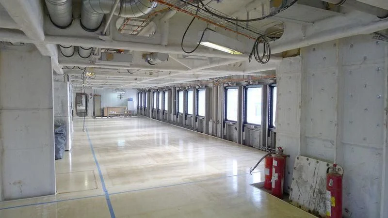 a room with a large floor and pipes aboard DREAM Yacht for Sale