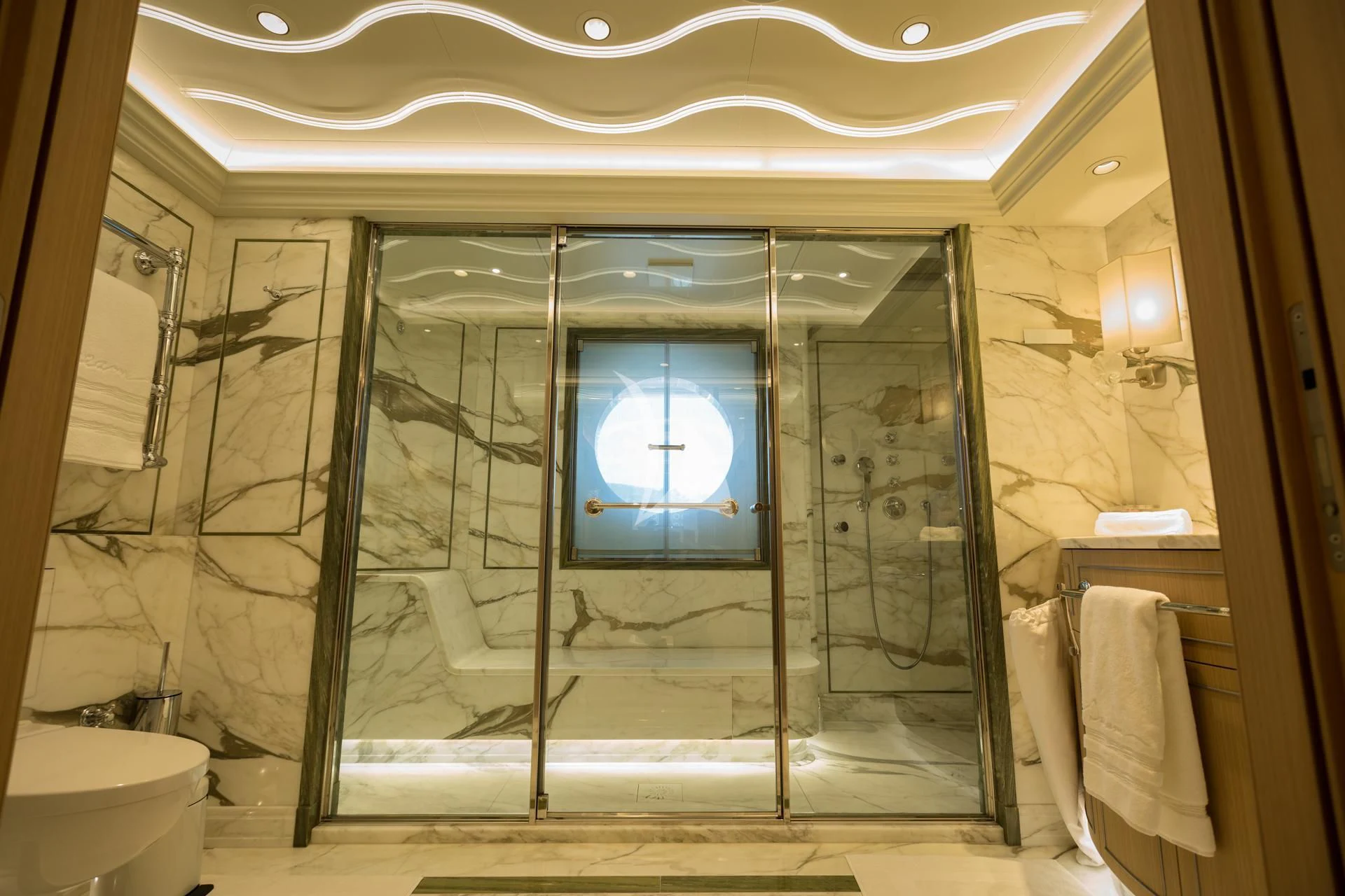 a bathroom with a glass shower aboard DREAM Yacht for Sale