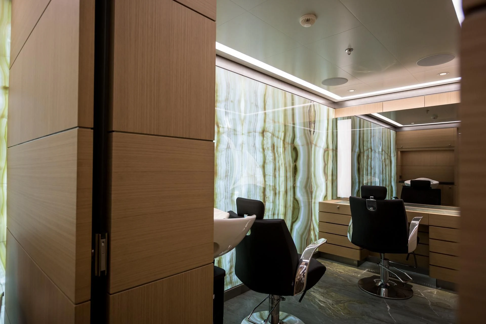 a room with a desk and chairs aboard DREAM Yacht for Sale