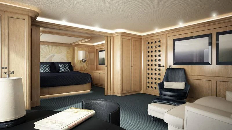 a room with a bed and a chair aboard DREAM Yacht for Sale