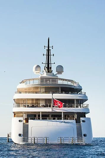 a large ship with a flag on the front aboard DREAM Yacht for Sale
