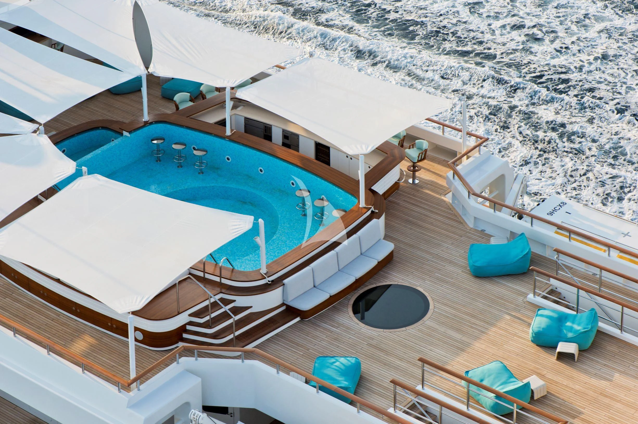 a swimming pool on a beach aboard DREAM Yacht for Sale