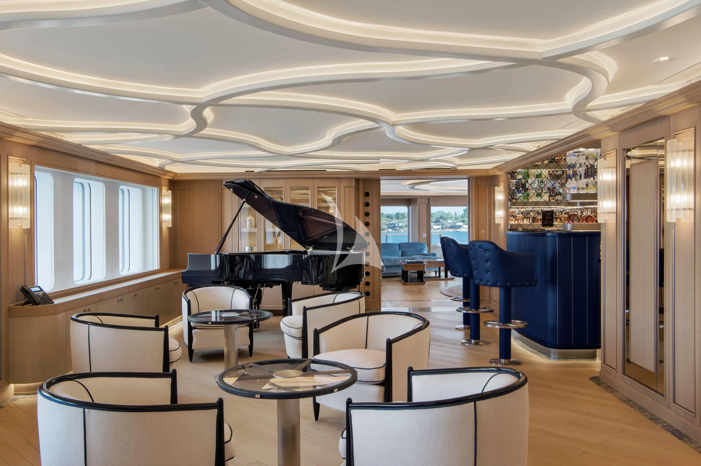 a large room with a piano and chairs aboard DREAM Yacht for Sale