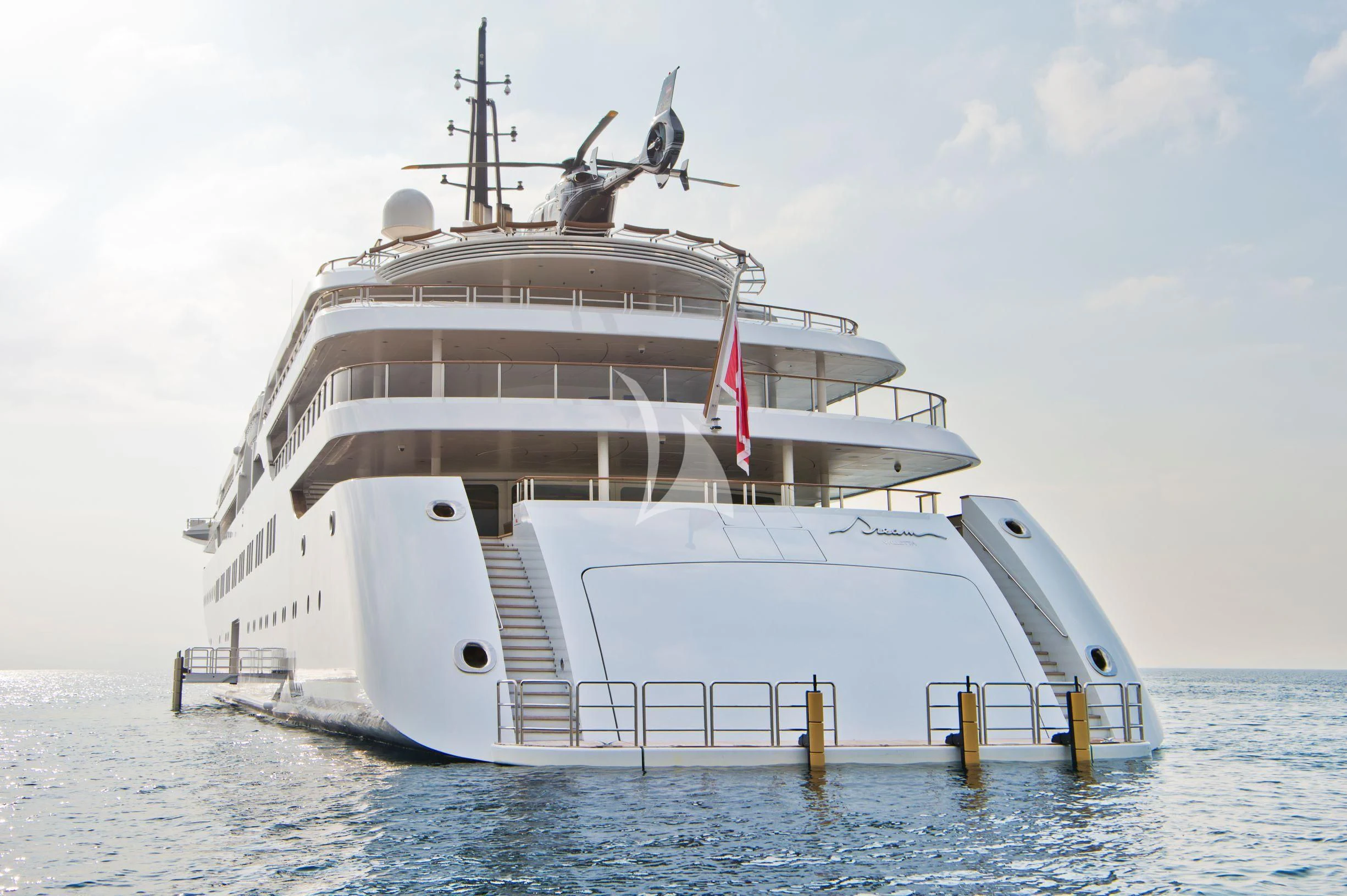 a large white ship in the water aboard DREAM Yacht for Sale