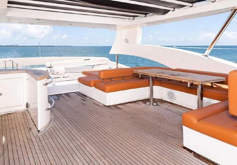 a room with a bed and a pool aboard JACRU Yacht for Sale