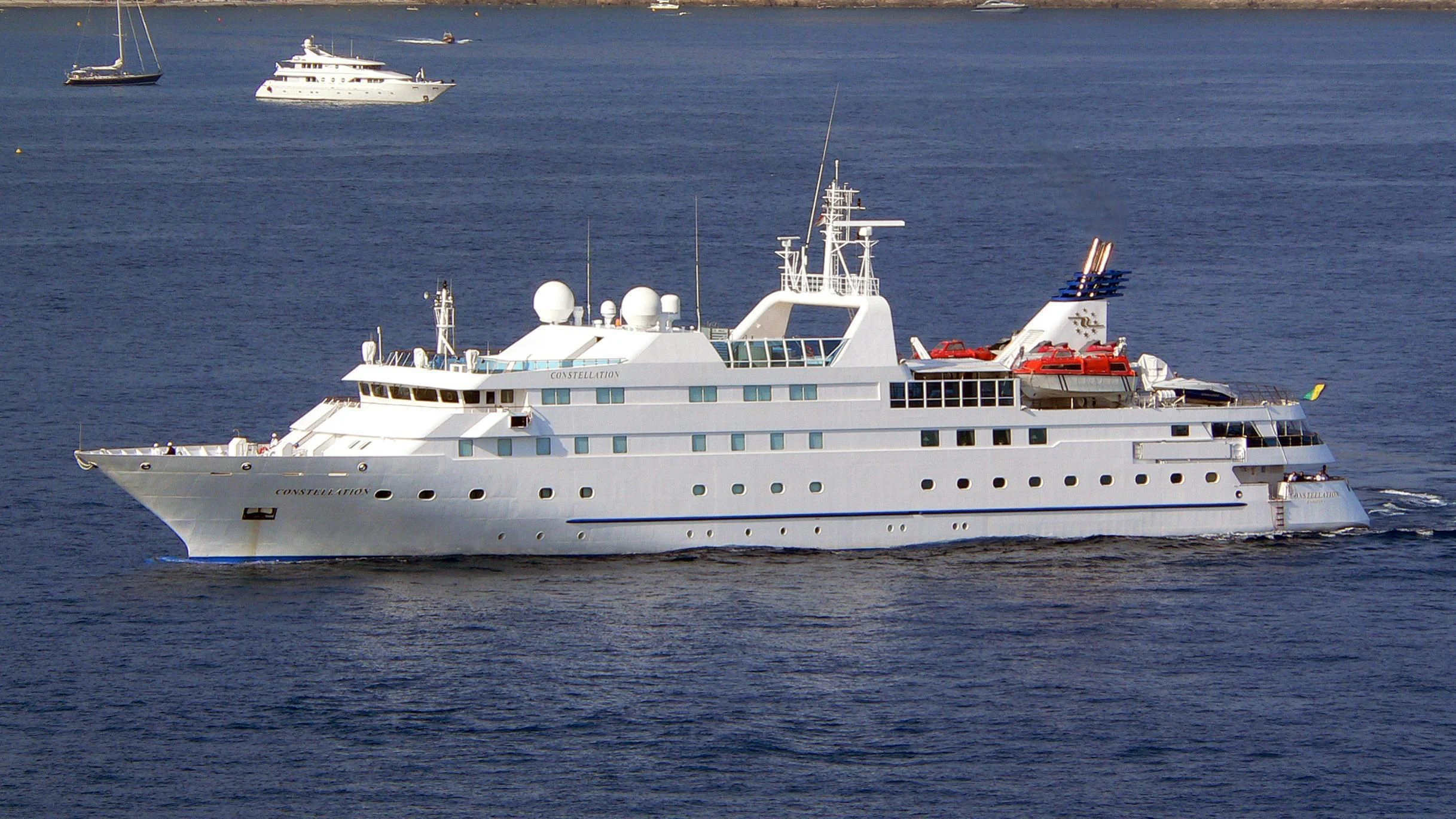 a large white ship in the water aboard LAUREN L Yacht for Sale