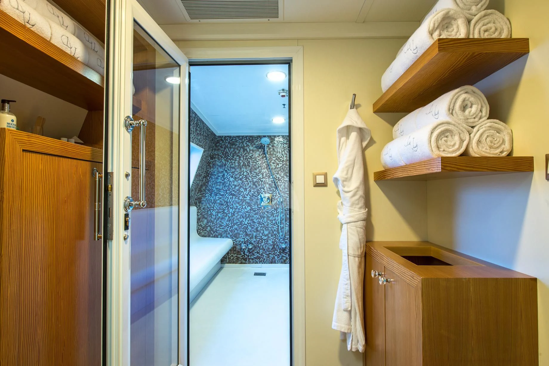 a room with a glass door and a white towel from the ceiling aboard LAUREN L Yacht for Sale