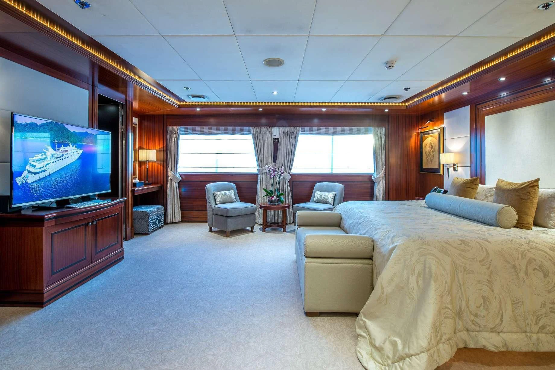 a hotel room with a large tv aboard LAUREN L Yacht for Sale