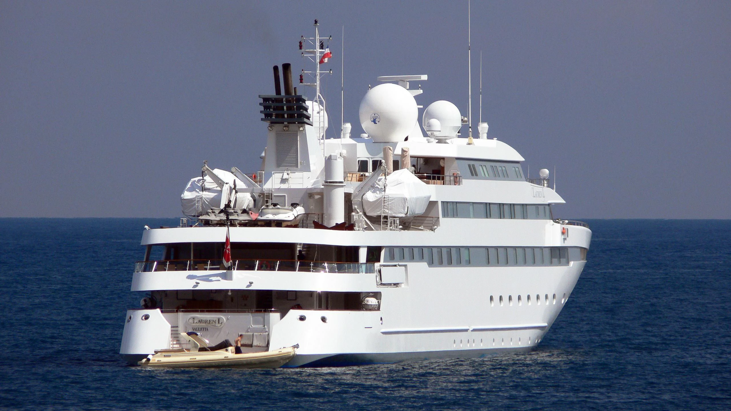 a large white ship in the water aboard LAUREN L Yacht for Sale