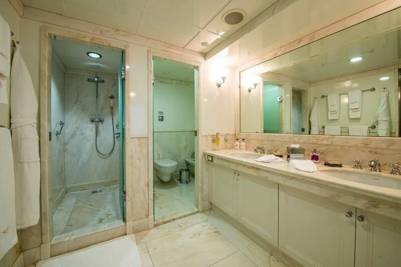 a bathroom with a glass shower aboard LAUREN L Yacht for Sale
